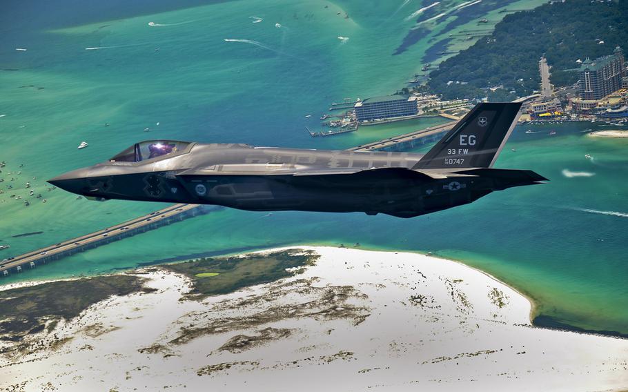 An F-35 Lightning II flies over Destin, Fla., before landing at its new home at Eglin Air Force Base, Fla., July 14, 2011. Its pilot, Lt. Col. Eric Smith is the first Air Force qualified F-35 pilot and is assigned to the 58th Fighter Squadron. (U.S. Air Force photo/Staff Sgt. Joely Santiago)

