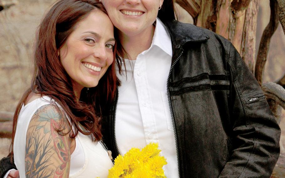 Air Force Master Sgt. Angela Shunk, left, and Tech. Sgt. Stacey Shunk, married in March in New York City's Central Park. The couple wants to start a family but faces an uncertain future together, since the Air Force won't allow them to apply to a program that tries to match military spouses with assignments at the same location. A federal law prevents U.S. government entities from recognizing the legal marriages of same-sex couples.
