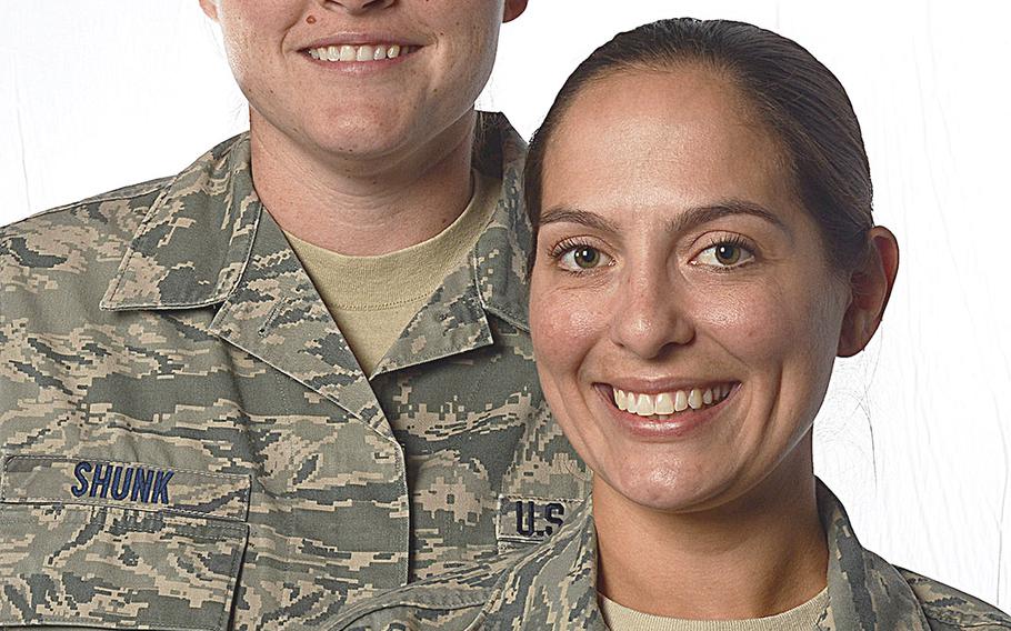 Tech. Sgt. Stacey Shunk, left, and Master Sgt. Angela Shunk are the first Air Force same-sex couple to be accepted for an assignment under the service's Join Spouse program.