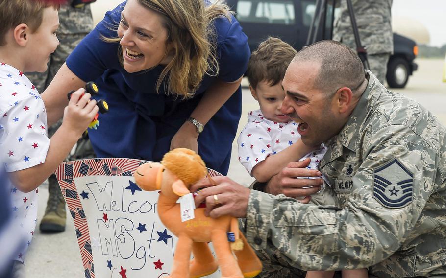 Master Sgt. Jeremiah Clarson, the 192nd Maintenance Squadron quality assurance inspector, greets his family at Joint Base Langley-Eustis, Va., on Thursday, Oct. 12, 2017. 