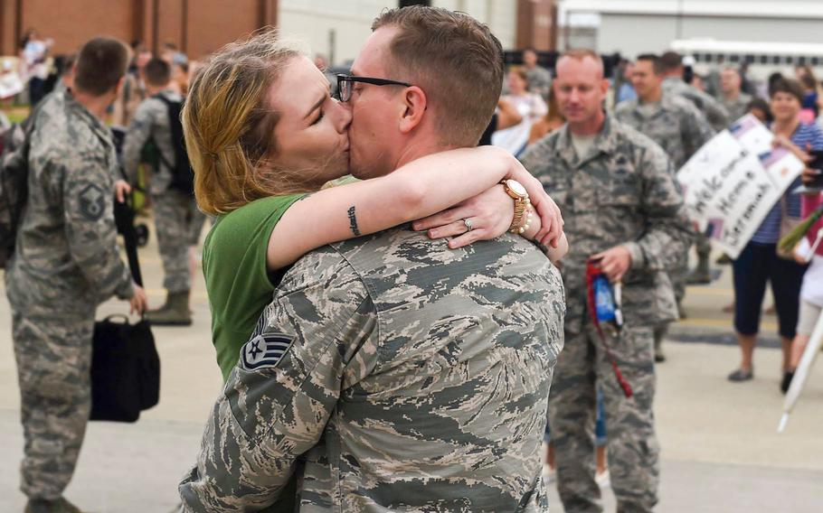 Sgt. Nathaniel Sorensen, 633rd Communications Squadron client systems supervisor, kisses his wife Sarah Sorensen, at Joint Base Langley-Eustis, Va., on Thursday, Oct. 12, 2017.