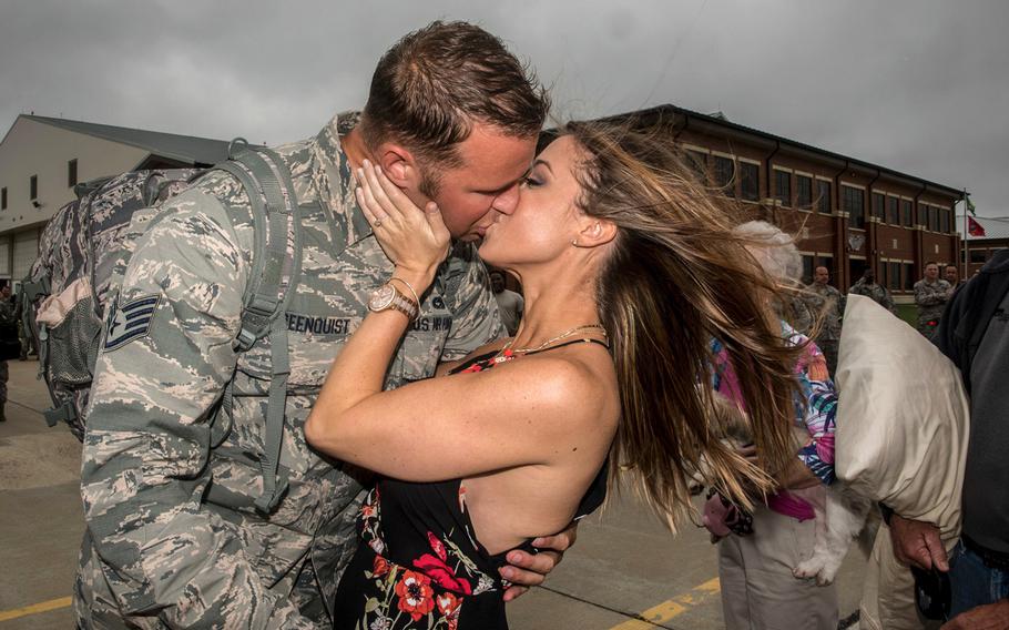 Virginia Air National Guard Staff Sgt. Jeff Greenquist, 192nd Maintenance Squadron low observable technician, kisses his fiancé Ashley Branham, at Joint Base Langley-Eustis, Va., on Thursday, Oct. 12, 2017, after she accepted his proposal to marry her.