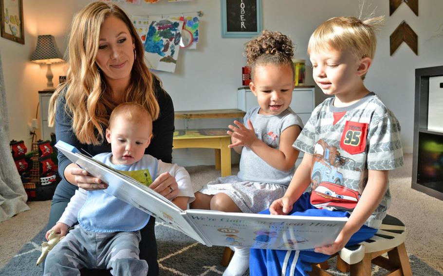 Family Child Care provider Emily Horn reads to children on Oct. 5, 2017,  at her home on Hanscom Air Force Base, Mass.