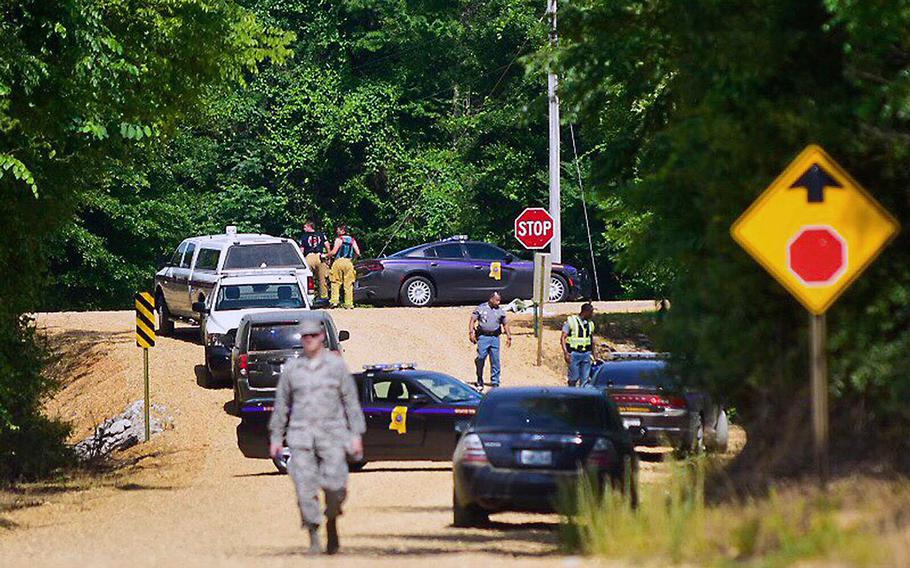 Authorities with Columbus Air Force Base work with local law enforcement and fire departments in responding to the scene of a U.S. Air Force T-38C Tallon II training jet crash, near the Lowndes-Monroe County line near Columbus, Miss., early Wednesday, May 23, 2018. 