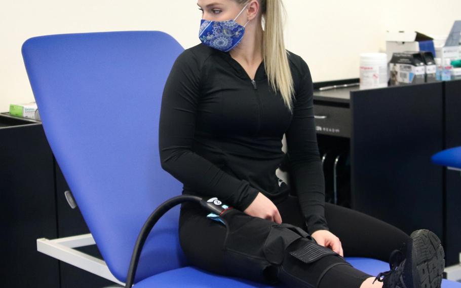 Air Force Staff Sgt. Katelyn Ramsey, an aviation resource manager with the 57th Rescue Squadron, has cold therapy treatment at the Comprehensive Operational Medicine for Battle Ready Airmen or (COBRA) clinic at Aviano Air Base in Italy. Ramsey is receiving treatment at the clinic for a chronic knee injury.