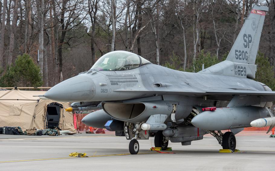 An F-16 Falcon sits on the Ramstein Air Base, Germany, flight line as airmen arrive for an agile combat employment exercise, March 22, 2021. The Spangdahlem-based airmen are at Ramstein to practice quickly deploying personnel and aircraft to forward locations.

