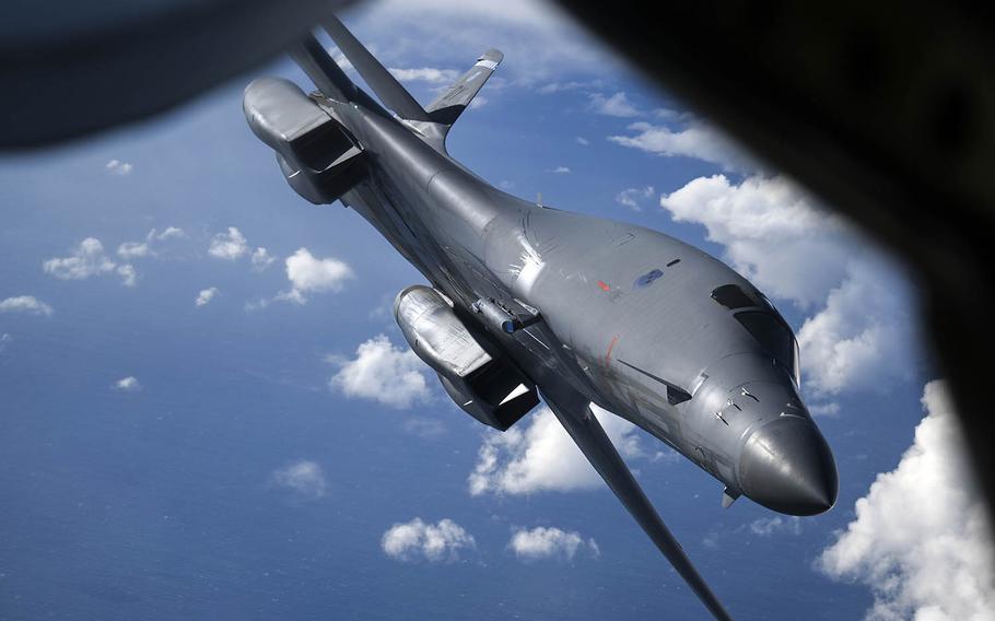 An Air Force B-1B Lancer bomber assigned to the 7th Bomb Wing flies away from a tanker after aerial refueling off the coast of Scotland, April 12, 2021.