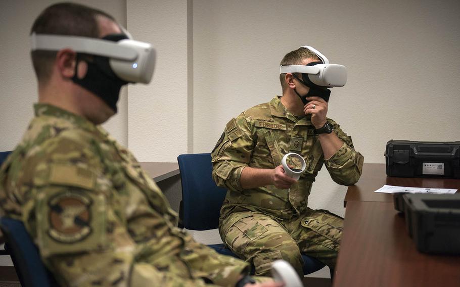 Air Force drone instructors test out Oculus Quest 2 virtual reality headsets at Holloman Air Force Base, N.M., April 12, 2021. 