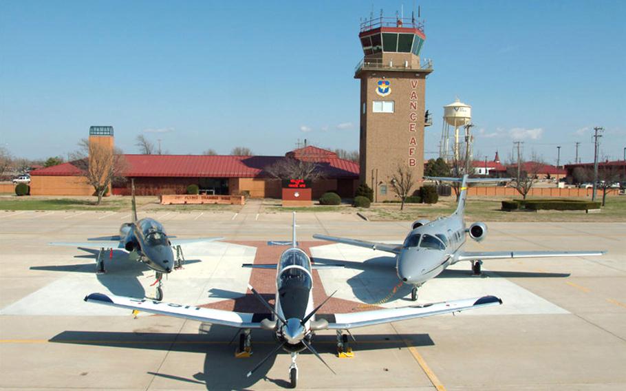 Airplanes sit in front on the control tower at Vance Air Force Base, Okla., in an undated photo.