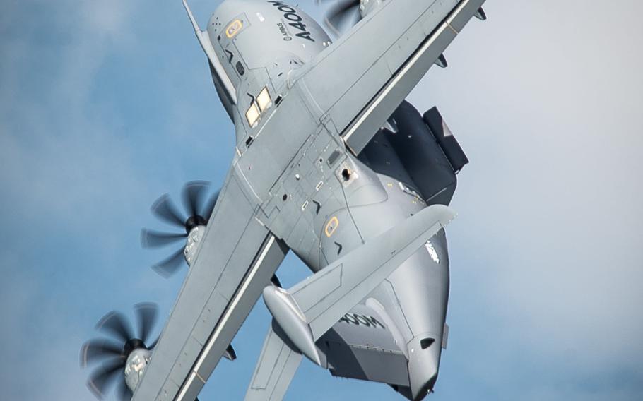An A400M cargo aircraft performs for a crowd of industry professionals and media members during the Paris Air Show at Le Bourget Airport, France, on Tuesday, June 16, 2015. The event is expected to bring in 315,000 people, 2,215 companies and 150 aircraft.