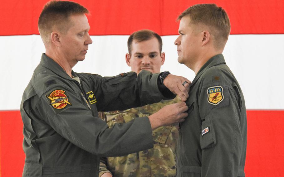 Col. Mike Schultz, commander of the 442nd Fighter Wing, pins the Distinguished Flying Cross on Maj. John Tice, a flight commander with the 303rd Fighter Squadron, during a ceremony at Whiteman Air Force Base, Mo., in November of 2019.