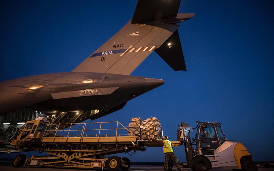 One of the Strategic Airlift Capability's three C-17 Globemasters is loaded with cargo in Eindhoven, Netherlands, for a flight to Saint Martin, April 5, 2020.