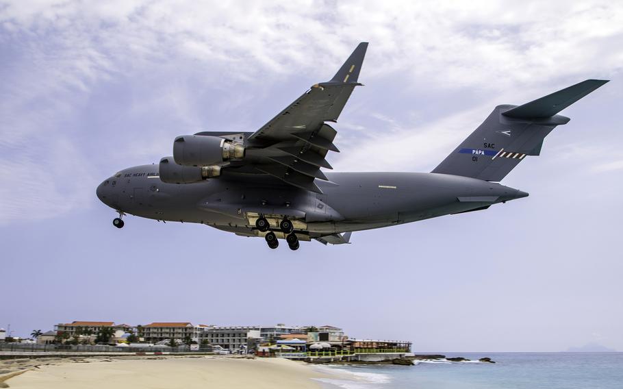 A Strategic Airlift Capability C-17, loaded with medical equipment, lands in Saint Martin, April 5, 2020.