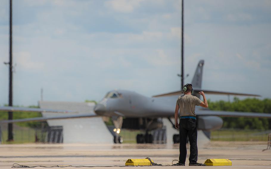 Senior Airman Brent Cook marshals a B-1B Lancer at Dyess Air Force Base, Texas, May 31, 2020.