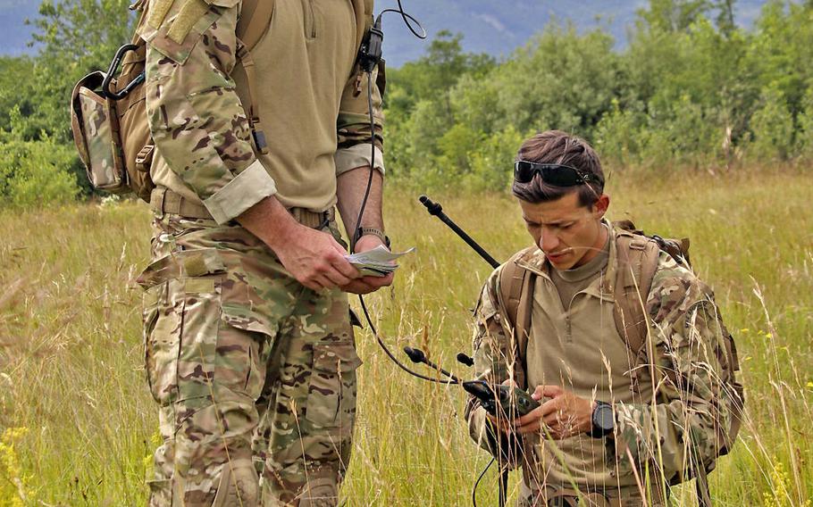 Master Sgt. Donald A. Jones, left, with the 56th Rescue Squadron and Tech. Sgt. Dylan Sedillo, of the the 31st Operations Support Squadron, conduct communications checks during Operation Porcupine, held in the town of Osoppo, Italy. The annual exercise was created to promote coordination among 31st Fighter Wing units at Aviano Air Base.