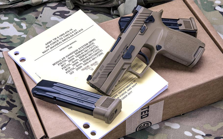 The Sig Sauer M18 is a 9-mm, striker-fired pistol with a coyote-tan PVD coated stainless steel slide with black controls. The Air Force has chosen the M18 as its new service pistol, replacing the M9 Beretta, which has been in service for 30 years.
