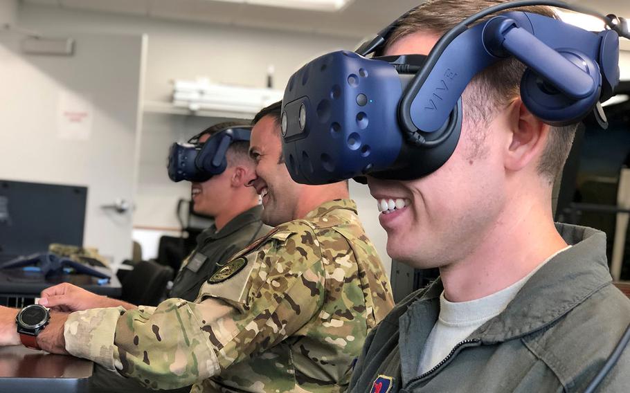 Students and an instructor pilot with the 23rd Flying Training Squadron take part in a virtual reality sortie during training at Fort Rucker, Ala., Oct. 9, 2019.