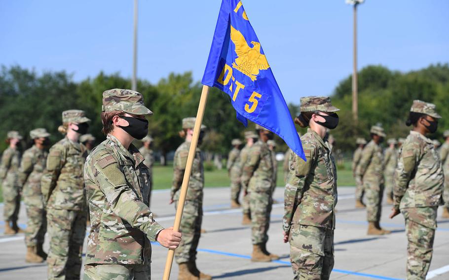 Air Force trainees stand in formation while graduating from basic military training at Keesler Air Force Base, Miss., Aug. 21, 2020.