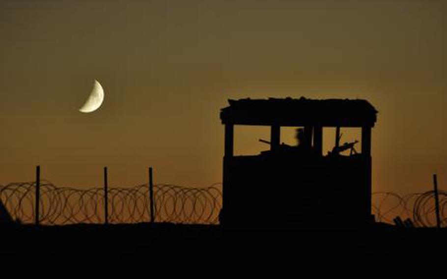 A soldier mans a security outpost at a construction site on the eastern edge of Khavejeh Molk, Afghanistan. Beginning next year, deployments for most troops will last nine months rather than the current 12 months.
