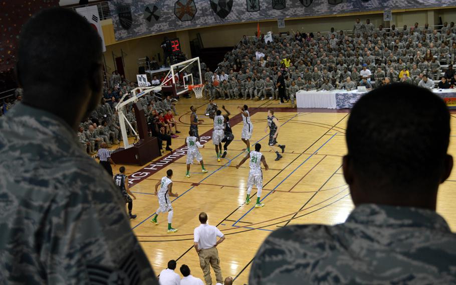 Airmen enjoy the 2013 Armed Forces Classic basketball game at Camp Humphreys, South Korea, on Saturday, Nov. 9, 2013. Oregon took on Georgetown during the NCAA season-opener and won 82-75.