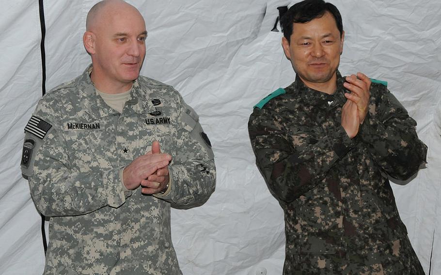 Eighth Army Deputy Commander for Operations Brig. Gen. Brian J. McKiernan, left, thanks U.S. and South Korean servicemembers March 12, 2014, at Yongsan Garrison, South Korea, during the Key Resolve 2014 exercise.