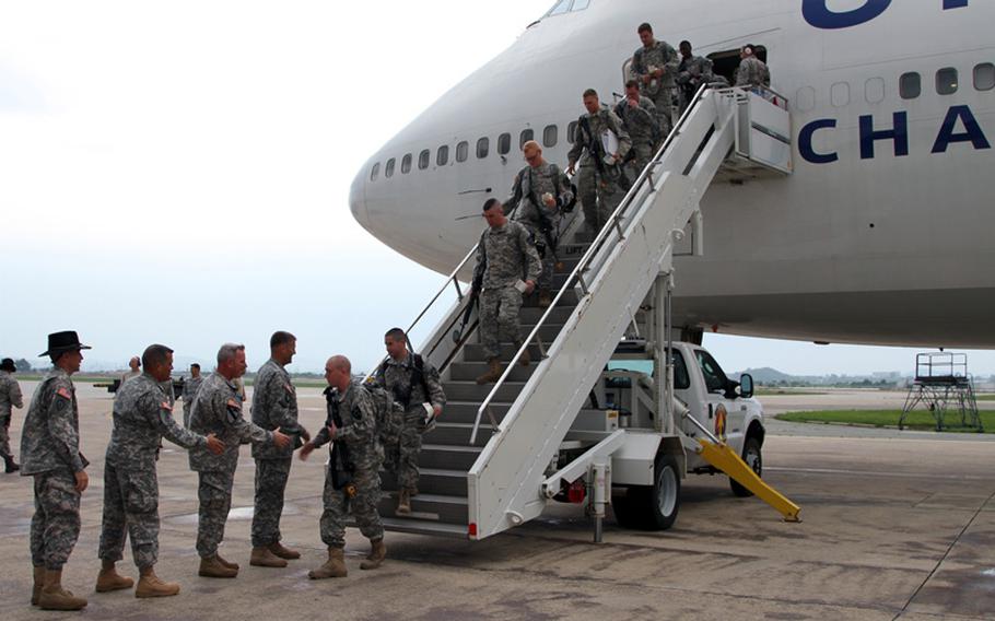 Soldiers of the 6th Squadron, 17th Cavalry Regiment, 16th Combat Aviation Brigade arrive at Osan Air Base, South Korea, on Tuesday, June 10, 2014, for a 9-month deployment.