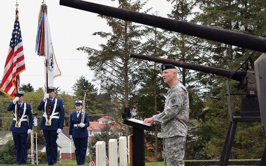 Flanked by World War II anti-aircraft artillery guns, Chaplain (Col.) James Brisson Jr., U.S. Army Alaska command chaplain, delivers remarks at the Sitka National Cemetery for Alaska Day ceremonies Saturday, Oct. 18. Alaska Day is celebrated as a state holiday, but no other city celebrates quite like Sitka, home of the original transfer ceremony which brought the Alaska Territory from Tsarist Russian to American control. Soldiers from the 9th U.S. Infantry were integral in the original ceremony, beginning a long, lasting relationship between the Army and Alaskans. 