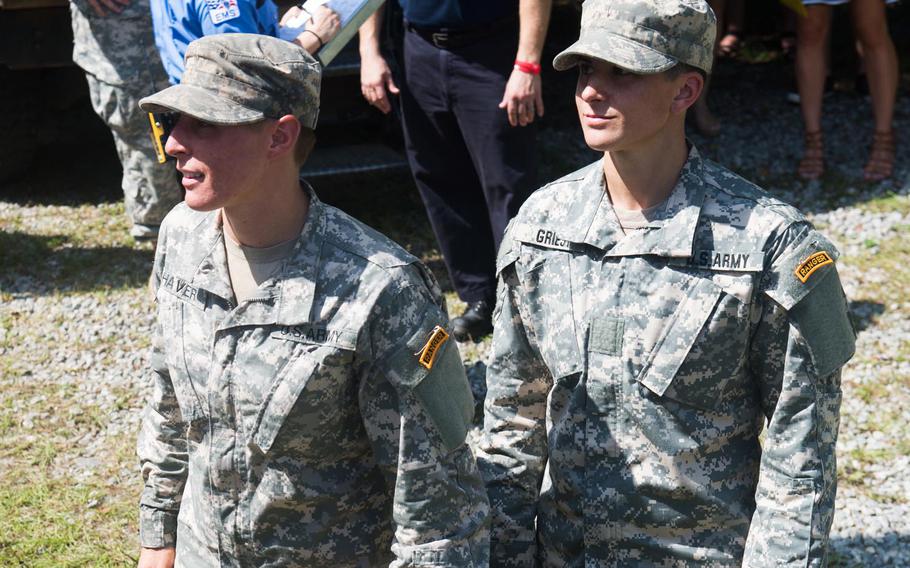Capt. Kristen Griest (right) and 1st Lt. Shaye Haver (left) receive their Ranger tab during their graduation From the U.S. Army Ranger School at Fort Benning, Ga., Aug. 21, 2015.  Griest and Haver became the first female graduates of the school. 