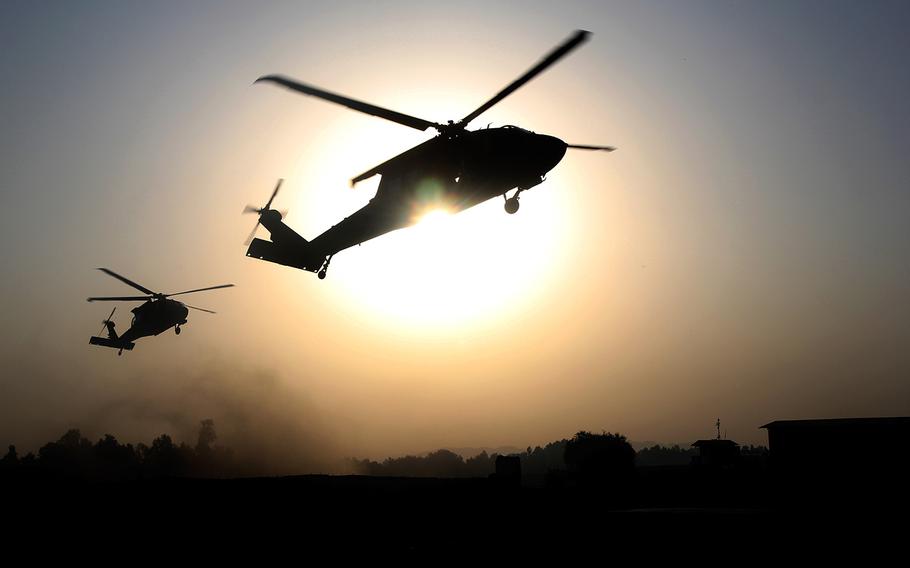 UH-60 Black Hawk helicopters from 101st Combat Aviation Brigade, 101st Airborne Division, hover over a Jalalabad Airfield landing zone in eastern Afghanistan, Sept. 16, 2015.