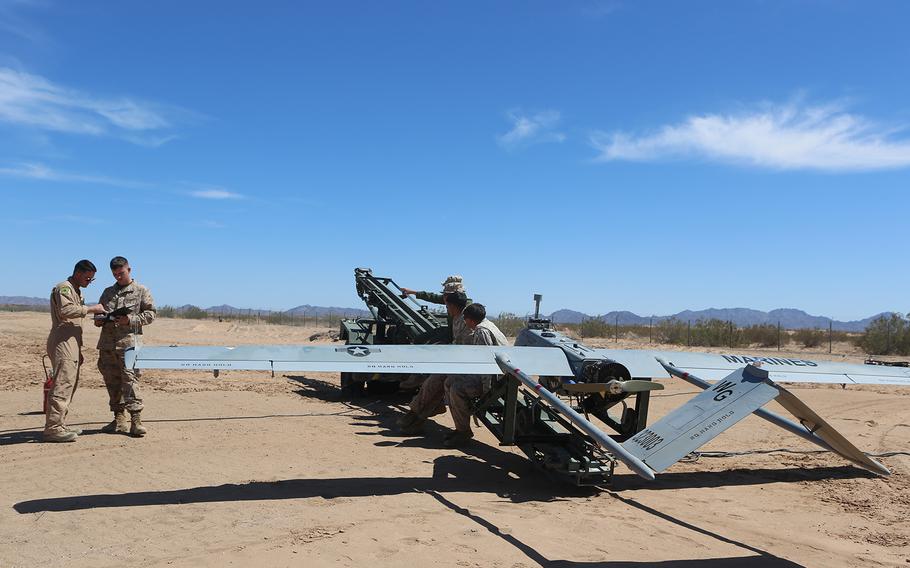 Marines with Marine Unmanned Aerial Vehicle Squadron (VMU) 1 perform function checks for the flight of the RQ-7Bv2 Shadow at Cannon Air Defense Complex in Yuma, Ariz., on March 25, 2016.