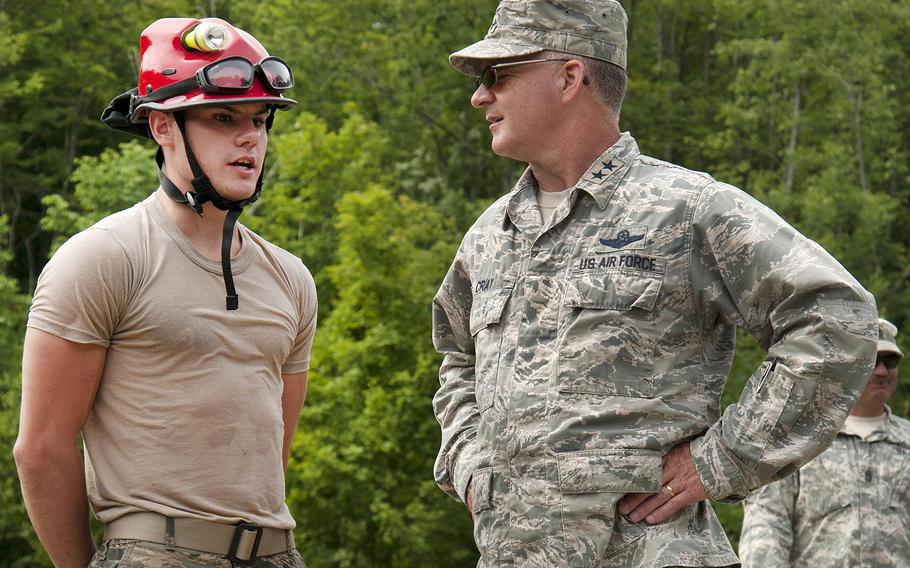 Air Force Airman 1st Class Reneau Bouchard, left, speaks with Air Force Maj. Gen. Steven Cray, adjutant general of the Vermont National Guard, about his role during Vigilant Guard 2016 at Camp Ethan Allen Training Site in Jericho, Vt., July 31, 2016.