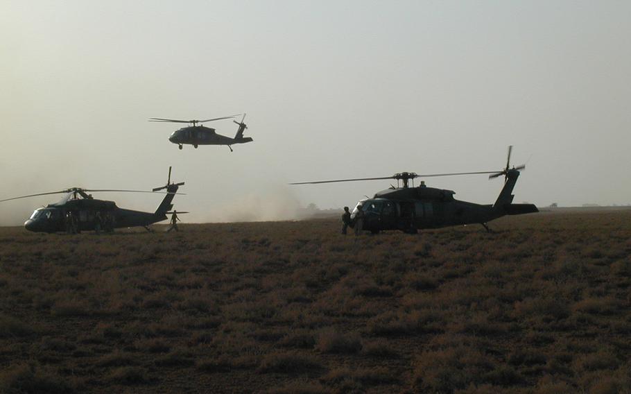 Black Hawks landing in Iraq on April 4, 2003. 