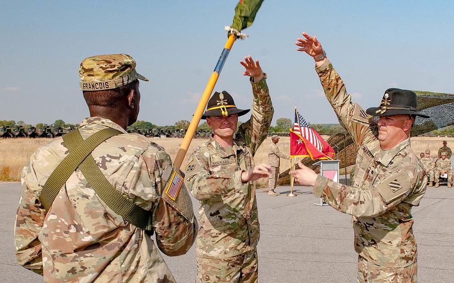 U.S. Army Lt. Col. Christopher S. Mahaffey, commander, and Command Sgt. Maj. Tim Bolyard (center), senior enlisted advisor, of 5th Squadron, 7th Cavalry Regiment, 3rd Infantry Division, stationed at Fort Stewart, Ga., finish casing their squadron colors Sep. 9, 2016, at Coleman Barracks in Mannheim, Germany.