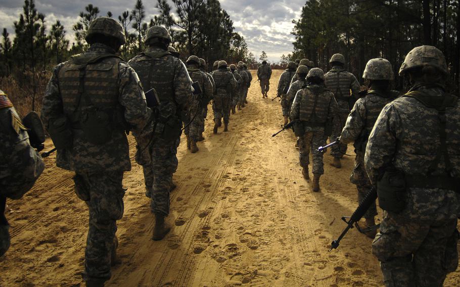 Army recruits practice patrol tactics while marching during U.S. Army basic training at Fort Jackson, S.C., Dec. 6, 2006.