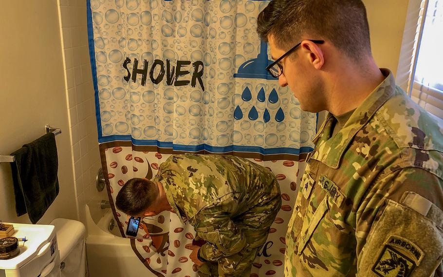First Sgt. Jeremy Crisp, left, senior enlisted advisor of the 22nd Mobile Public Affairs Detachment, Headquarters and Headquarters Battalion, XVIII Airborne Corps, conducts a command visit with Sgt. Andrew McNeil on Fort Bragg, N.C., on April 5, 2019. Crisp wanted to document maintenance issues and to help ensure McNeil's housing issues would be addressed properly. 