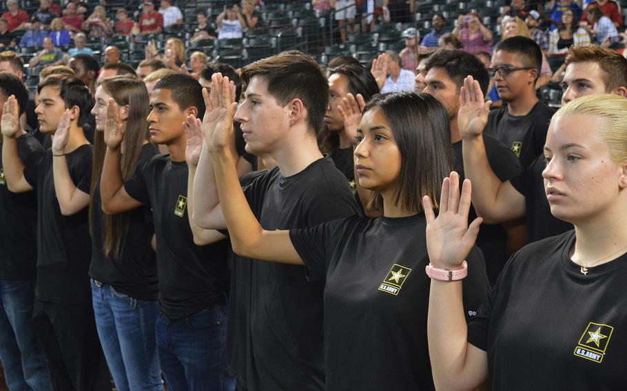 As part of a mass enlistment ceremony, Army recruits from the Phoenix Recruiting Battalion recite the oath of enlistment, Aug. 26, 2018, Chase Field, Phoenix. The Army came up short in 2018 of meeting its recruiting goal of enlisting 76,500 soldiers. By the end of this fiscal year on Sept. 30, the Army’s goal is to add 68,000 new active-duty recruits.
