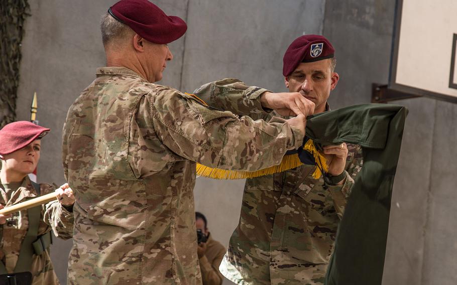 U.S. Army Lt. Gen. Paul J. LaCamera, commanding general of XVIII Airborne Corps, and Command Sgt. Maj. Charles Albertson, command sergeant major of XVIII Airborne Corps, case the XVIII Airborne Corps colors at the Combined Joint Task Force – Operation Inherent Resolve transfer of authority ceremony in Baghdad on Saturday, Sept. 14, 2019.