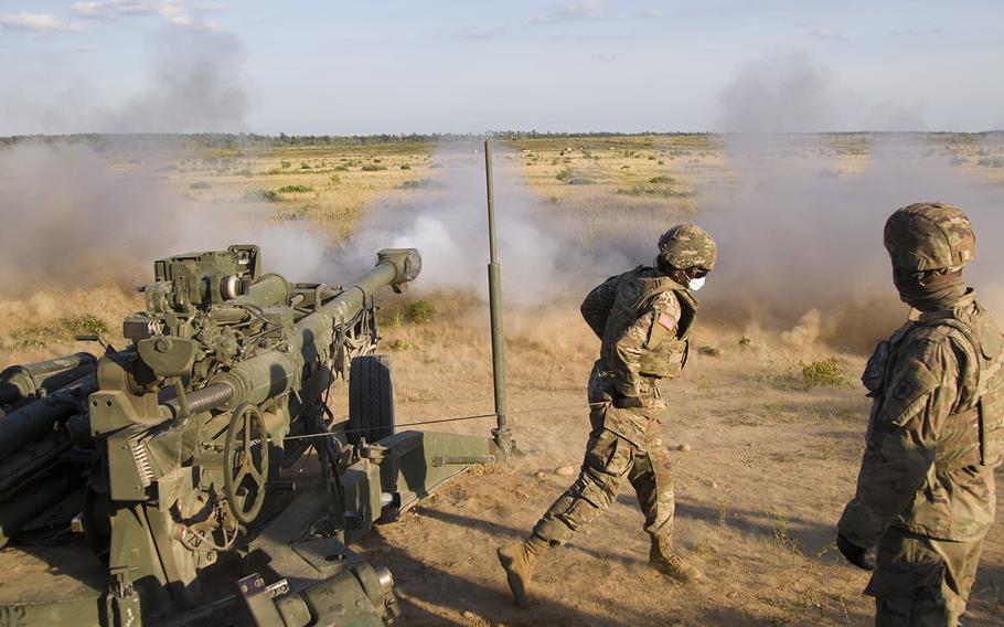 A U.S. Army soldiers assigned to Bravo Battery, 1st Battalion, 119th Field Artillery Regiment, Michigan Army National Guard, fire a M777 155mm howitzer as part of a direct fire training exercise during Northern Strike 20, Camp Grayling, Mich., on July 25, 2020. 