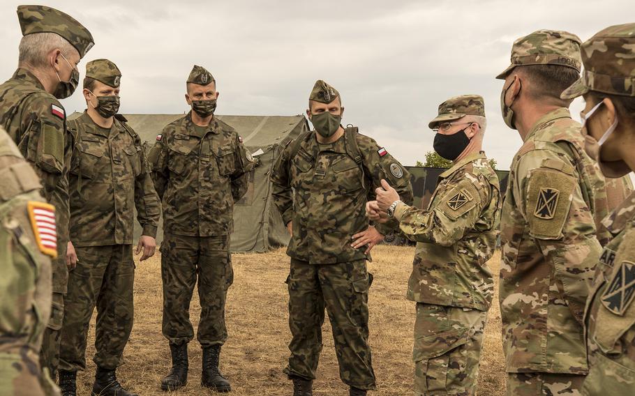 A Polish delegation, assigned to the 37th Air Defense Squadron, visits with U.S. Soldiers assigned to the 10th Army Air and Missile Defense Command on Aug. 4, 2020, in Baumholder, Germany. The purpose of the visit was to familiarize the Polish soldiers with the patriot missile system and the Table VIII Gunnery qualification.