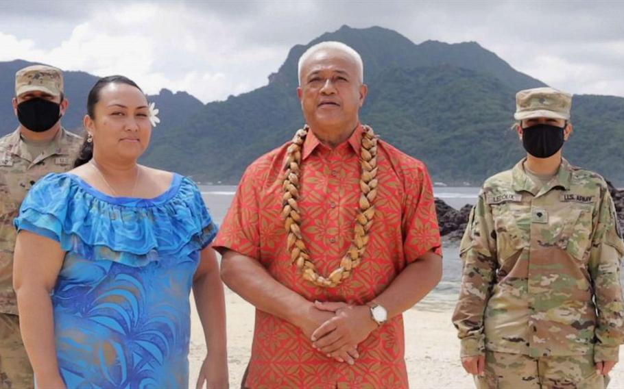In this image from video, two soldiers stand at attention as Aliitama Sotoa, the chairman of the American Samoa Democratic Party, second from left, casts the territory’s 11 votes for former Vice President Joe Biden in a brief segment of the Democratic National Convention on Tuesday, Aug. 8, 2020. Standing next to Satoa is Petti Matila, who serves as an executive assistant at the American Samoa Department of Commerce. 