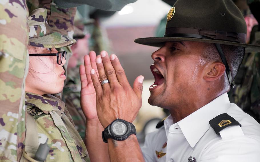 A U.S. Army drill sergeant assigned to the34th Infantry Regiment uses the "shark attack" method on a recruit during basic training on June 12, 2017, at Fort Jackson, S.C. The Army says it will no longer shout in recruits' faces and use intimidation to establish authority and weed out the weak during basic training.