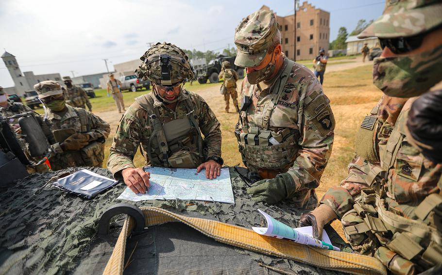Col. Robert Born, commander of 1st Brigade Combat Team, 101st Airborne Division (Air Assault), briefs Maj. Gen. Brian E. Winski, commanding general of the 101st Airborne Division and Fort Campbell, Ky., about his defensive plan on a map on Sept. 19, 2020, during operations at Joint Readiness Training Center-Fort Polk, La.