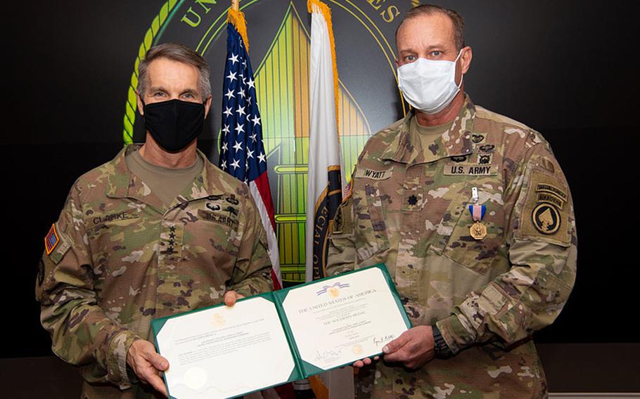 Gen. Richard D. Clarke, commander, U.S. Special Operations Command, presents Lt. Col. Larry Wyatt, USSOCOM clinic director, with a Soldier’s Medal at MacDill Air Force Base, Fla., Dec. 22, 2020. He was awarded the medal for delivering lifesaving care to two people after a motorcycle collided with bicyclists April 7, 2019, despite being injured himself. 

