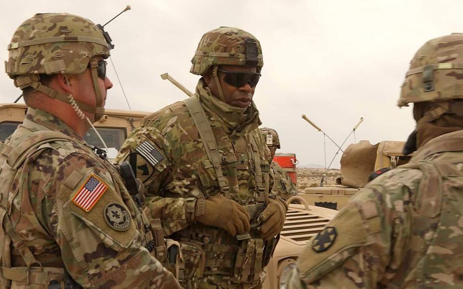 Brig. Gen. James Smith, center, talks with soldiers at Fort Irwin, Calif., in February 2020. Smith, chief of transportation and commandant of the U.S. Army Transportation School, has been selected to be the next commanding general of the 21st Theater Sustainment Command, headquartered in Kaiserslautern, Germany.

