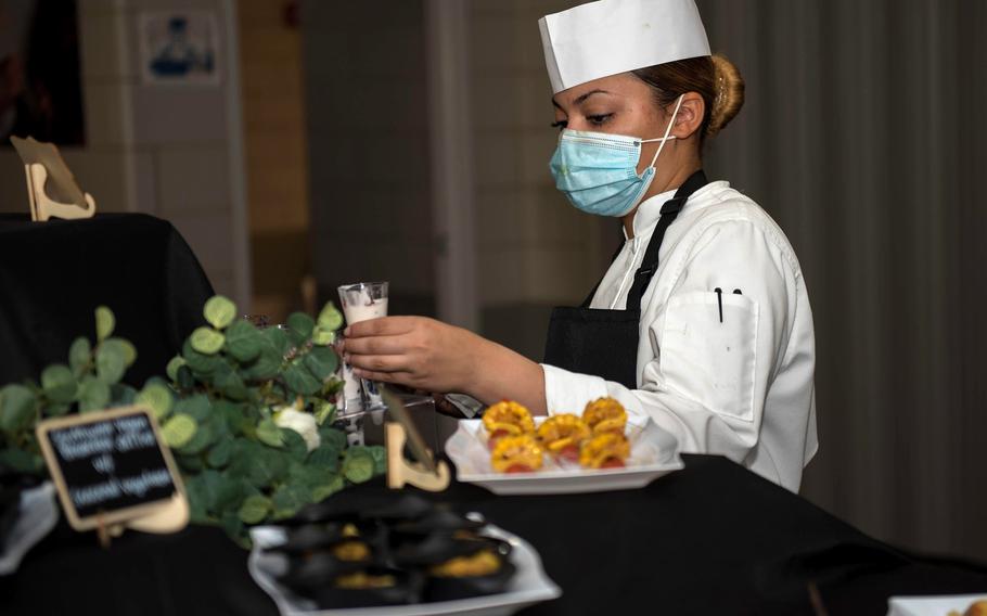 Spc. Stephanie Bryant, 3rd Cavalry Regiment, prepares food during Taste Fest at Fort Hood, Texas, March 12, 2021.