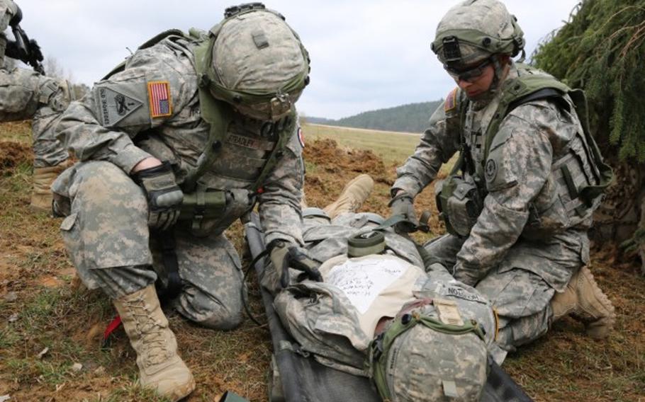Soldiers assigned to Bravo Troop, 1st Squadron, 2nd Cavalry Division strap a soldier with a simulated injury to a litter during an exercise in Hohenfels, Germany, April 12, 2015. StatBond, a gel developed with military funding, may allow medics to stop arterial bleeding without the need for compression, Army Research Laboratory officials said May 4, 2021.
