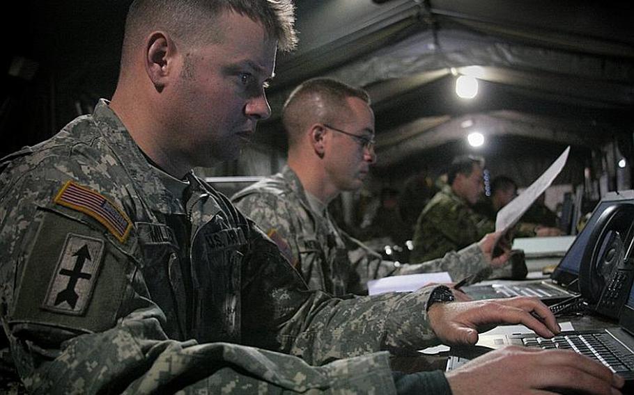 First Lt. Roger Miller coordinates logistics during a bilateral computer-simulation combat exercise Thursday. The Yama Sakura exercise tests the ability of U.S. and Japanese ground forces to coordinate communications, intelligence-sharing and troop movements in a computer-simulated environment at Camp Kengun in southwestern Japan, headquarters of Japan's Western Army.