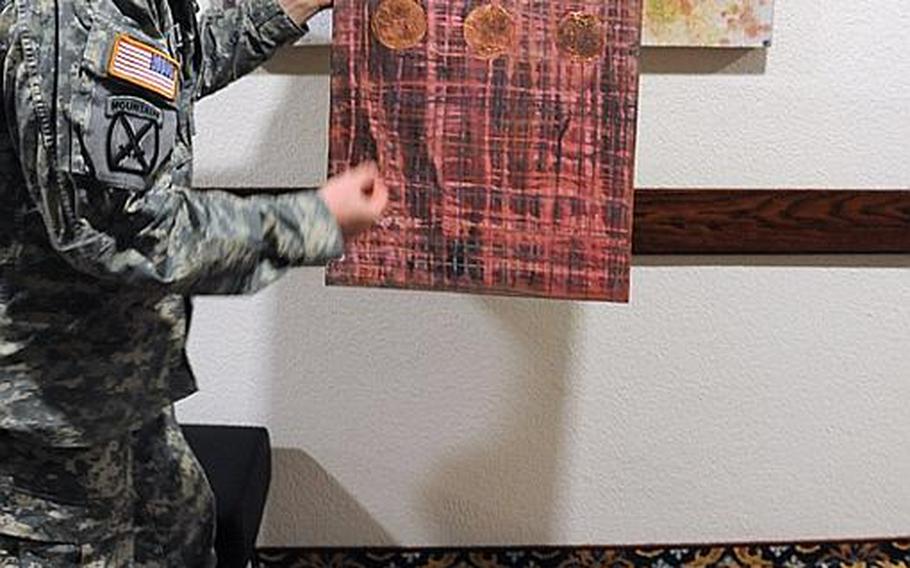 Sgt. Ron Kelsey explains how he made 'Beauty Through Sacrifice,' one of his works in the 'Reflections of Generosity: Toward Restoration and Peace' exhibit.