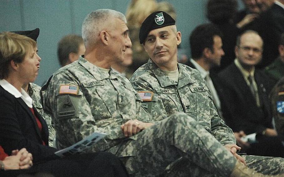 Lt. Gen. Mark Hertling, left, commander of U.S. Army Europe, speaks with Col. James E. Saenz, the incoming commander of U.S. Army Grafenwoehr, during a ceremony on Tuesday. Hertling later told reporters he expects the garrison to continue in its current size, although tenant units may change.