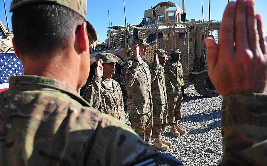 A mass re-enlistment takes place in Afghanistan in October. Under new guidelines, brigade-level commanders have the authority to decide which soldiers will be allowed to re-enlist.